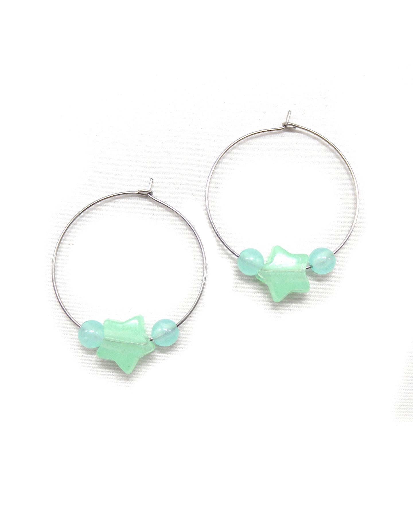 Boucles d'oreilles créoles étoiles phosphorescentes - ETHELLE