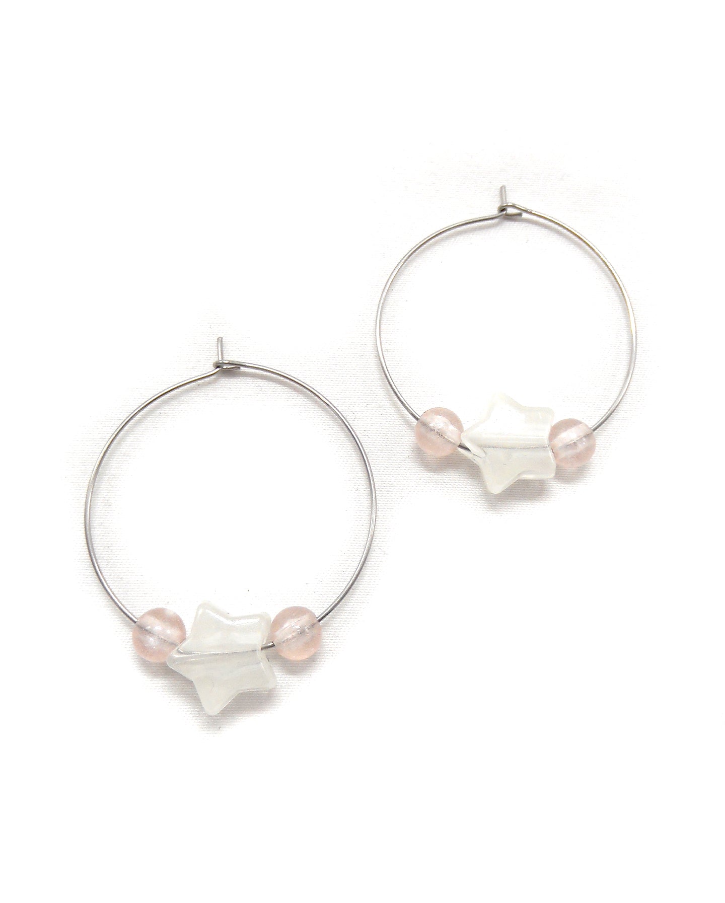 Boucles d'oreilles créoles étoiles phosphorescentes - ETHELLE