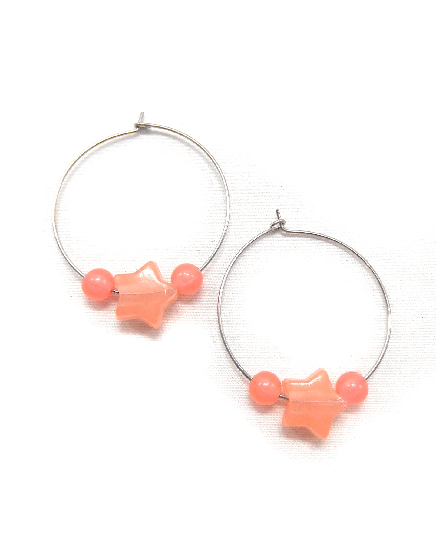 Boucles d'oreilles créoles étoiles phosphorescentes - ETHELLE